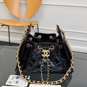 CHANEL Black Quilted Lambskin Drawstring Bucket Bag with Gold Chain